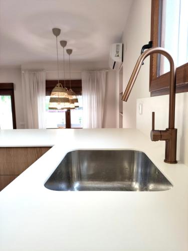 a kitchen sink in a white counter top at Villa Thálassa in Benicarló