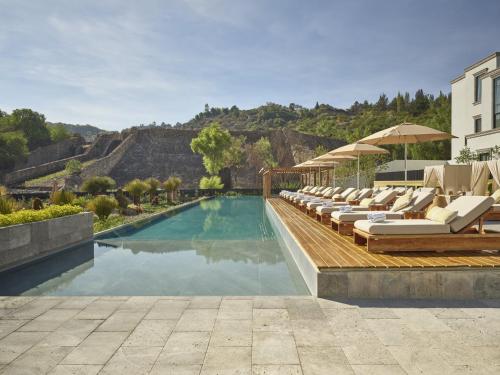 a swimming pool with lounge chairs and a resort at Live Aqua San Miguel de Allende in San Miguel de Allende