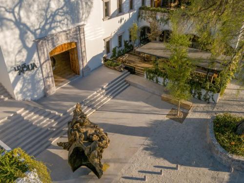 a statue in front of a building at Live Aqua San Miguel de Allende in San Miguel de Allende