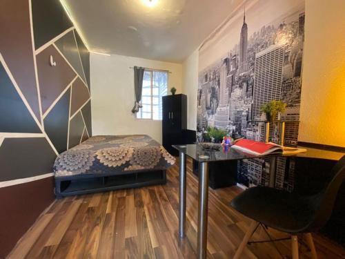 a bedroom with a bed and a desk in a room at ROOMIES HOSTEL Condesa in Mexico City