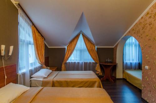Кровать или кровати в номере Отель Старая Слобода