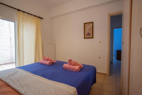 Ένα ή περισσότερα κρεβάτια σε δωμάτιο στο Villa Festos