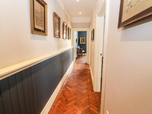 a hallway of a home with a wooden floor at The Merchant's Store in Kilrush