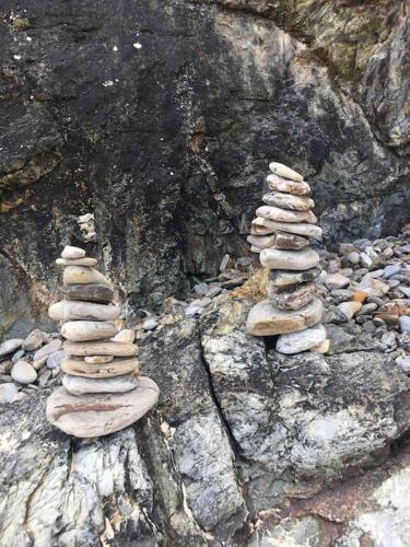 a group of rocks sitting on top of a mountain at St Ives Balcony Flat in St Ives