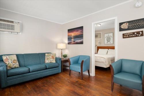 a living room with a couch and two chairs and a bed at Beach Bum West-O Cabins in Ocean City