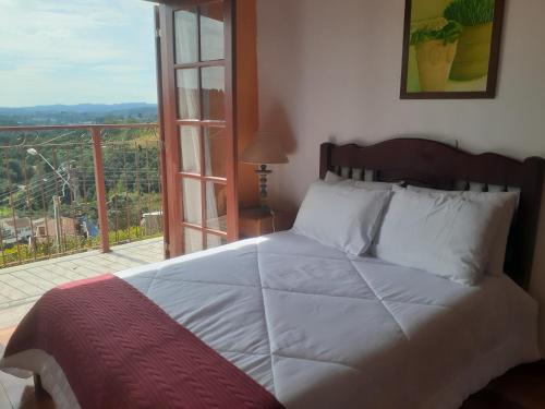 A bed or beds in a room at Casa Bela Vista