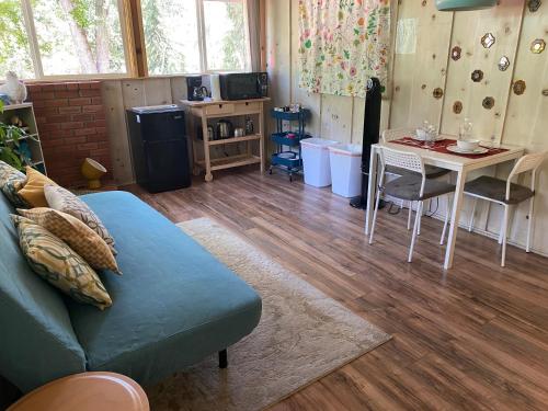 a living room with a couch and a table at Private 1 Bd near Yosemite and Bass lake in Oakhurst