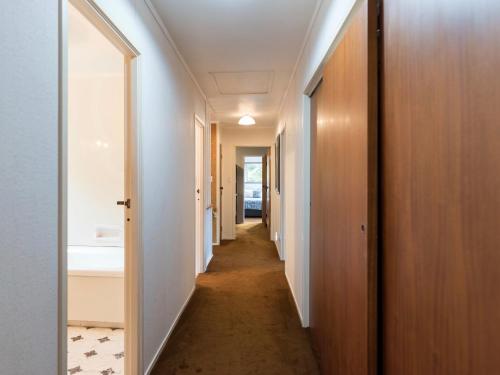 a hallway leading to a bathroom in a house at Central Spacious Family House - Paihia House in Paihia