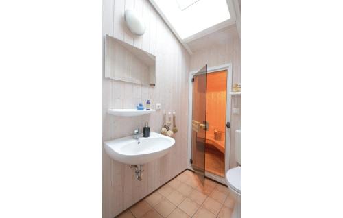 a bathroom with a sink and a toilet at Strandblick 20 in Schönhagen