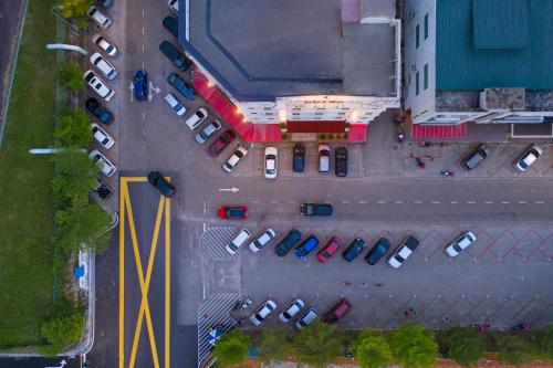 an overhead view of a parking lot with parked cars at 1 Million Hotel in Johor Bahru