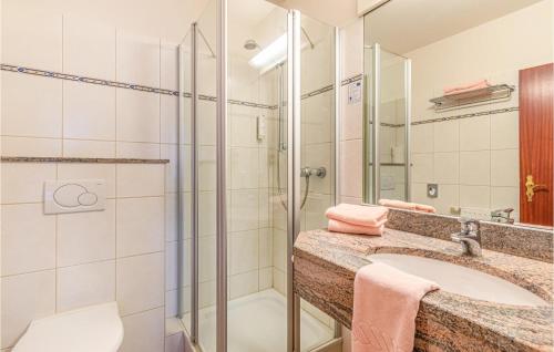 a bathroom with a sink and a shower at Hotel Wittensee in Groß Wittensee