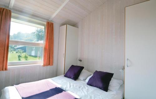 מיטה או מיטות בחדר ב-Strandblick 3 - Dorf 1