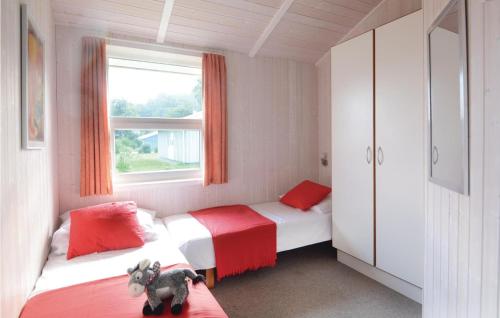 A bed or beds in a room at Dnenpark 15 - Dorf 6