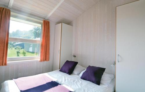 מיטה או מיטות בחדר ב-Strandblick 9 - Dorf 1