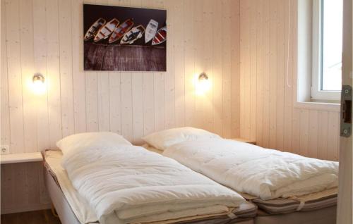 Giường trong phòng chung tại Friedrichskoog-deichblick 11