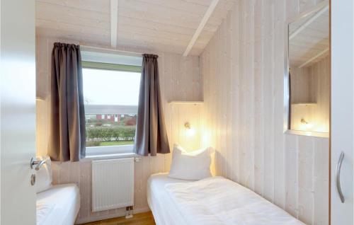 En eller flere senge i et værelse på Friedrichskoog-strandpark 17