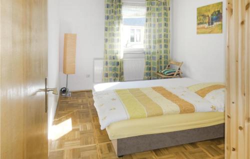 a bedroom with a bed and a window at 2 Bedroom Lovely Apartment In Nahetal-waldau in Hinternah
