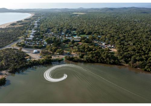 an aerial view of the shore of a lake at Discovery Parks - Coolwaters, Yeppoon in Kinka