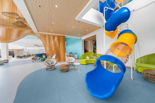 a childrens play room with a slide at Solea Coast Resort Panglao in Panglao