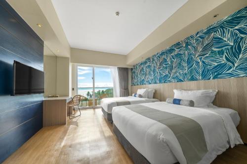 Postel nebo postele na pokoji v ubytování Solea Coast Resort Panglao