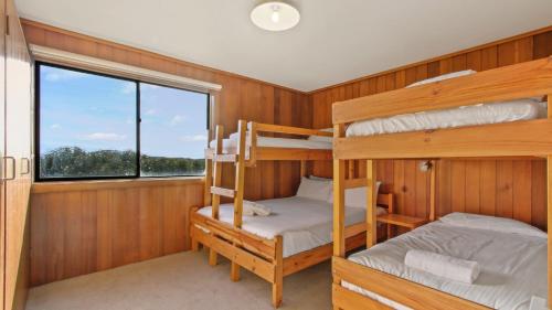 a bedroom with bunk beds in a boat at 1750 Hotham 11 in Mount Hotham