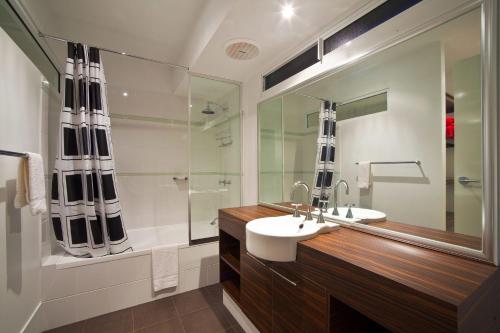 a bathroom with a sink and a shower at Osprey Holiday Village Unit 103 2 Bedroom in Exmouth