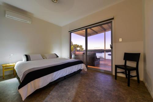 Ένα ή περισσότερα κρεβάτια σε δωμάτιο στο 78 Madaffari Drive