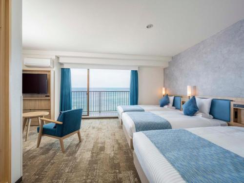 Postel nebo postele na pokoji v ubytování Atagawa Ocean Resort