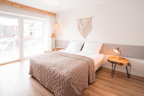 Postel nebo postele na pokoji v ubytování BOHO Apartments