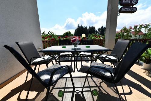 a table and chairs sitting on a patio at Apartment Marija Zupan in Rakovica