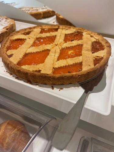 a pie sitting on top of a white shelf at Palazzo Gatto Art Hotel & SPA - BW Premier Collection in Trapani