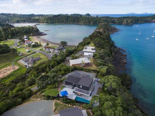 an aerial view of a house on a island in the water at Moonlit Knights - Tutukaka Holiday House in Tutukaka
