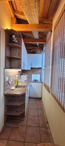 a kitchen with a sink and a counter top at Apartmaji Sonce Izola in Izola