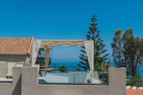 a house with a view of the ocean at Fiorentinos Villa in Tragaki