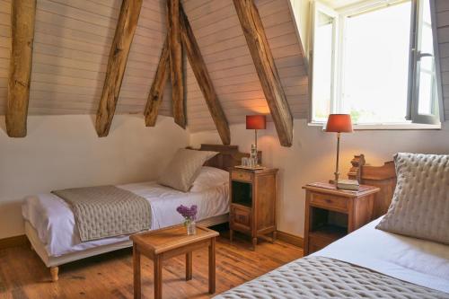 Tempat tidur dalam kamar di Domaine du Vidal