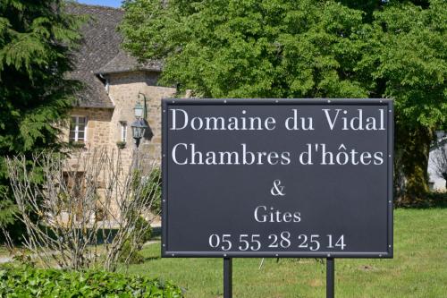 a sign in front of a yard with a house at Domaine du Vidal in Camps
