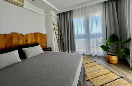 Postel nebo postele na pokoji v ubytování Hotel Hey Peñíscola
