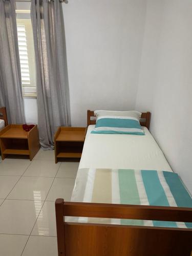 מיטה או מיטות בחדר ב-Apartments Kristina