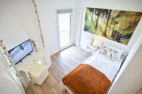 Habitat Esslingenにあるテレビまたはエンターテインメントセンター