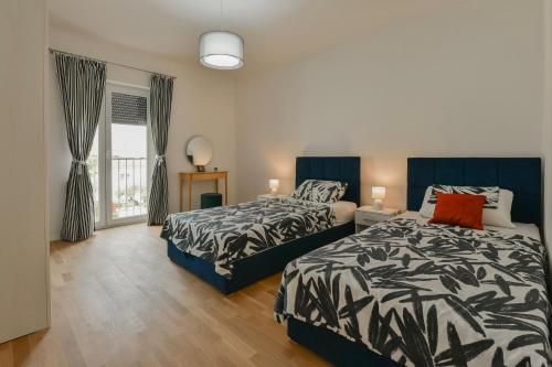 Posteľ alebo postele v izbe v ubytovaní NEW LUXURY 3 Bedroom 4 Air Conditioners