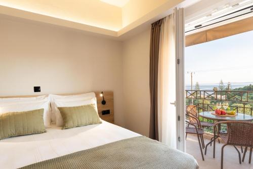 Posteľ alebo postele v izbe v ubytovaní POSEIDON SeaSide Deluxe Suites