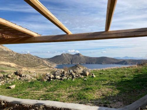 a view of a mountain and a lake from a window at Tortuga house 180 sea view - Serifians Residences in Serifos Chora