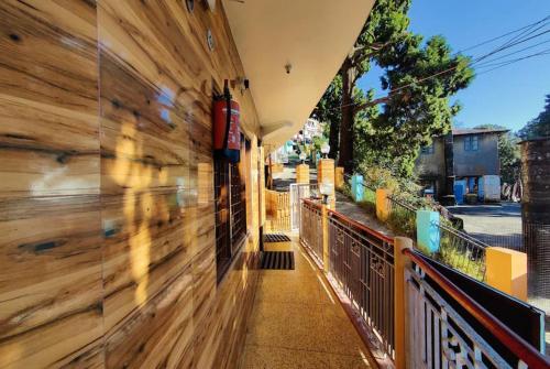 a hallway of a building with a wooden wall at Hotel Surya Lake view in Nainital
