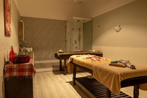 a hospital room with two beds and a piano at AQI Pegasos World in Side