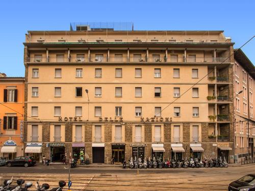 a large building with motorcycles parked in front of it at Hotel Delle Nazioni in Florence