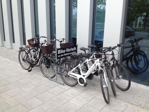 a group of bikes parked outside of a building at H2 Hotel München Messe in Munich