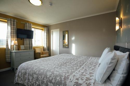 Castlemead Country House By The Seaにあるベッド
