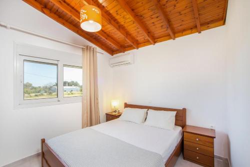 Posteľ alebo postele v izbe v ubytovaní Platanos House