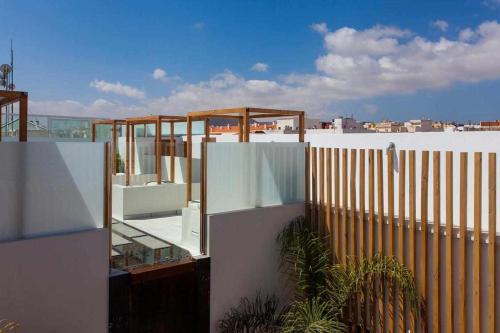a view from a balcony of a building with a fence at Hotel Vacanzy Urban Boutique Adults Only in Corralejo