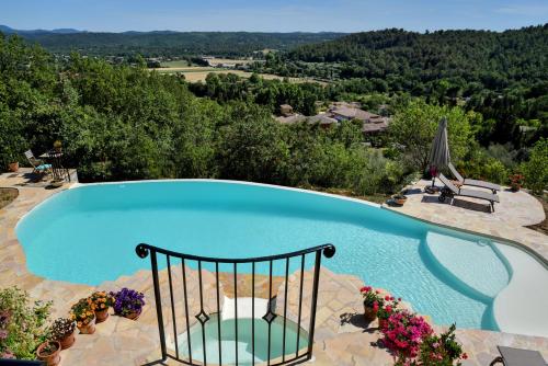 a swimming pool with a view of a mountain at Chambre d'hôtes Cottes in Callian